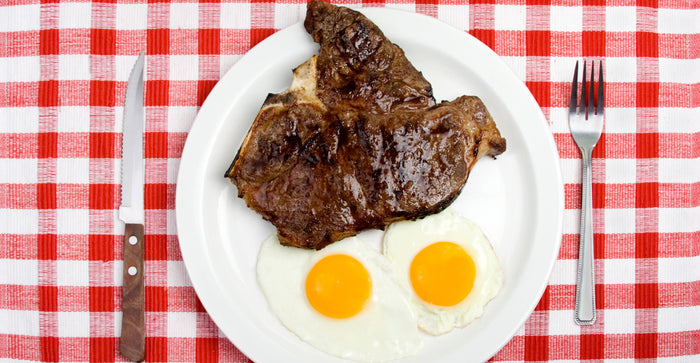 steak and eggs in plate