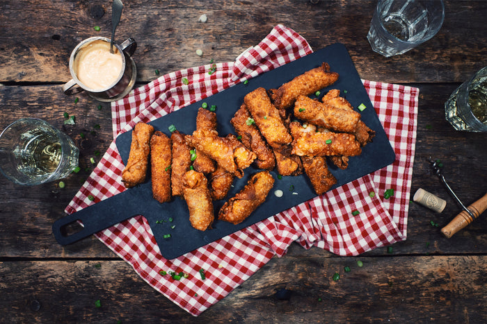 many egg rolls on slate plate