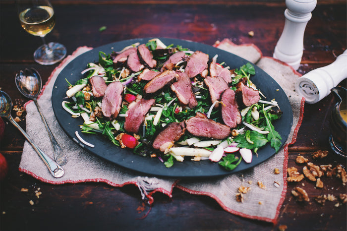 duck breast slices on salad
