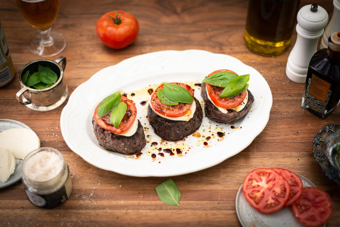 three beef tenderloins, tomatoes, basil leaves