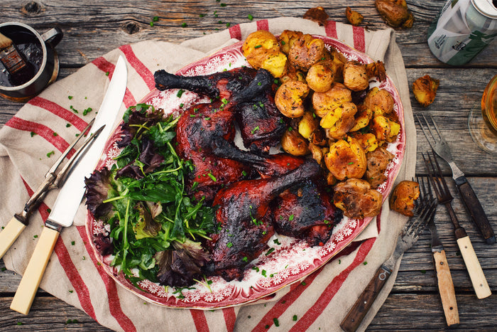grilled duck legs, potatoes, arugula