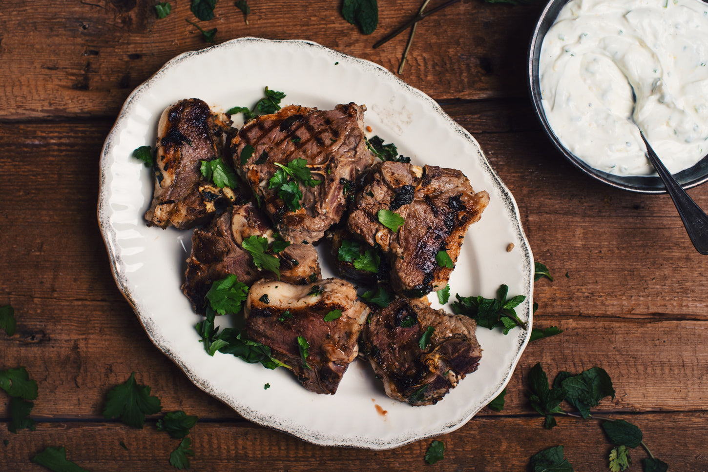 lamb chops with cilantro, bowl of cream