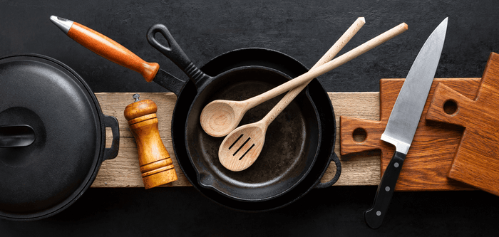 kitchen utensils on wooden plate
