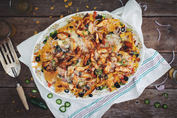 nachos plate with chicken, cheese and veggies