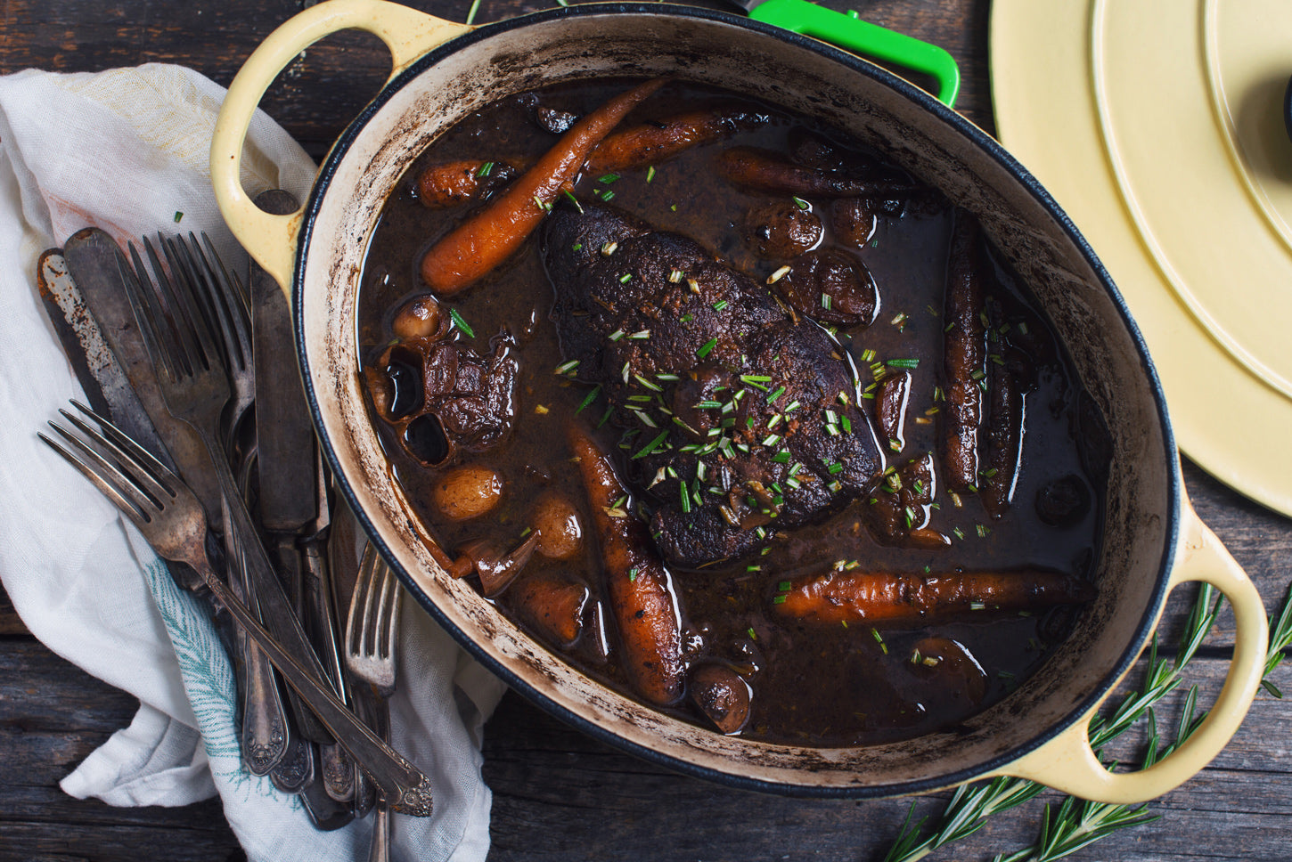 beef roast in pot with carrots